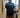 Person wearing a beige cap with 'JEREMIAD' branding, standing in a doorway.