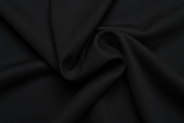 Close-up of black fabric with folds